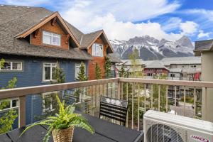 a balcony with a view of a mountain at CHARMING 1 Bdrm plus loft with VIEWS managed by Little Sister Getaways in Canmore