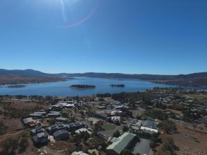 an aerial view of a town next to a lake at Acacia Snowy Motel in Jindabyne