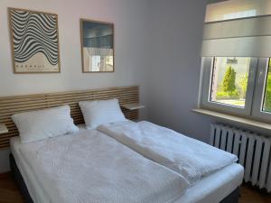 Posteľ alebo postele v izbe v ubytovaní Apartamenty Studio