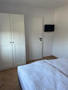 Posteľ alebo postele v izbe v ubytovaní Apartamenty Studio