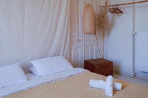 Ένα ή περισσότερα κρεβάτια σε δωμάτιο στο Karma Hostel