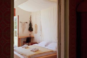 Ένα ή περισσότερα κρεβάτια σε δωμάτιο στο Karma Hostel