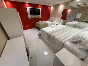 Postel nebo postele na pokoji v ubytování Roraima Apart Hotel + 37 fotografií