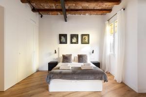 Postel nebo postele na pokoji v ubytování Enjoy Apartments La Riera One