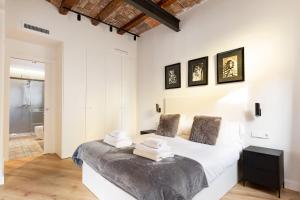 Postel nebo postele na pokoji v ubytování Enjoy Apartments La Riera One