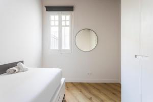 Postel nebo postele na pokoji v ubytování Enjoy Apartments La Riera One