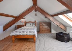 Postel nebo postele na pokoji v ubytování Holly Cottage