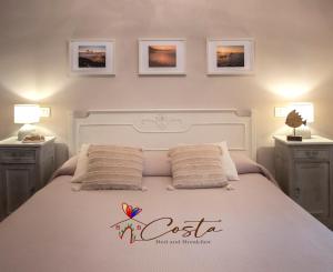 A bed or beds in a room at Costa Bed and Breakfast