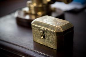 a gold box sitting on top of a table at Jawi Peranakan Mansion in George Town