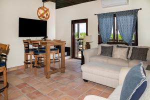 a living room with a couch and a table at X'tan Ha- The Waterfront in San Pedro