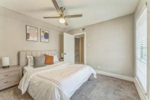 a bedroom with a bed and a ceiling fan at Stratton 2501f I Comfy 2 Bed 2 Bath in Arlington +15 photos