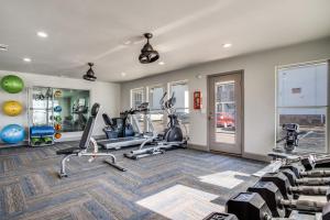 a fitness room with treadmills and elliptical machines at Stratton 2501f I Comfy 2 Bed 2 Bath in Arlington