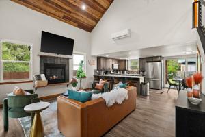 a living room with a couch and a fireplace at Rainier XL Chalet EV-Hot Tub-Game Room-Guest Suite in Ashford