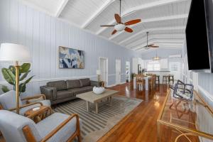 a living room with a couch and a table at Channel Vibes in Myrtle Beach