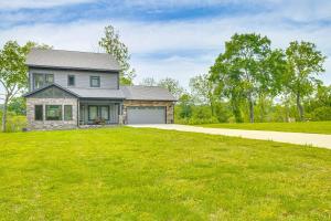 a home with a large grassy yard at Anglers Retreat on the White River Pets Welcome! in Cotter