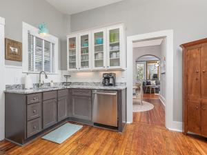 a kitchen with a sink and a counter top at Whitaker By Design in Savannah