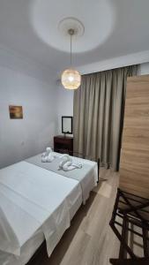 Ένα ή περισσότερα κρεβάτια σε δωμάτιο στο Apostolidis Home +25 φωτογραφίες
