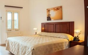 Voodi või voodid majutusasutuse Saba Arawak Hotel toas