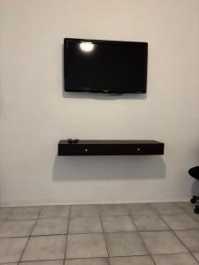 TV a/nebo společenská místnost v ubytování Casa Jardín