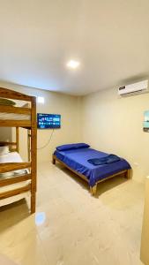 Ένα ή περισσότερα κρεβάτια σε δωμάτιο στο Alojamiento en Punta Blanca, Villa Victoria del Mar