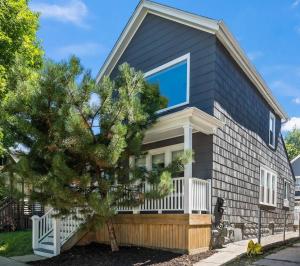 a house with a large window on the side of it at Stylish Apt in Walker's Point in Milwaukee