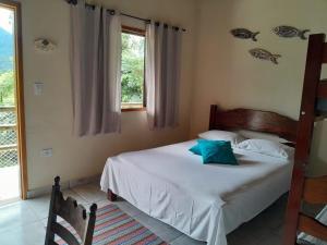 Ένα ή περισσότερα κρεβάτια σε δωμάτιο στο Ashtar Village - Pousada em Itamambuca