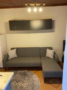 a living room with a couch and a table at Arya nature çiftlik in Marmaris +1 photo