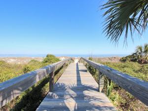 a wooden boardwalk leading to the beach at Lighthouse Point 20A in Tybee Island