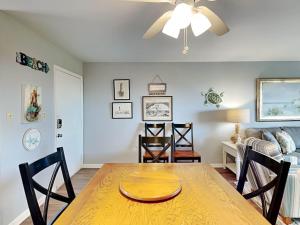 a dining room with a table and chairs at Lighthouse Point 20A in Tybee Island
