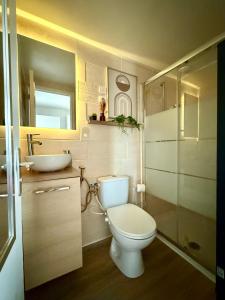 a small bathroom with a toilet and a sink at Studio 3 - Cinéma Sport Parking - DABNB in Limoges +26 photos