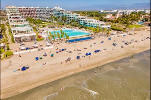 an aerial view of a beach with a resort at Apartamento Luxury Nayarit vista al mar Mexico in Nuevo Vallarta 