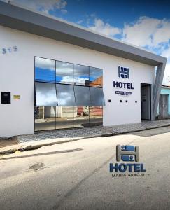 a building with a sign on the side of it at Hotel Maria Araújo in Arapiraca +18 photos