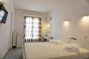 Postel nebo postele na pokoji v ubytování Polos Hotel Paros