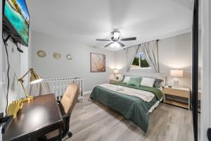 a bedroom with a bed and a desk and a piano at Entire Luxury 3-Bedroom House with Hot Tub, Garage, King Bed, Available Now in Spring Valley