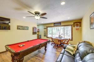 a living room with a pool table in it at Black Hills Vacation Lodge New Home! Just Opened! in Newcastle