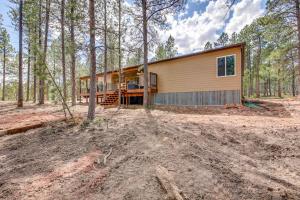 a house in the middle of the woods at Black Hills Vacation Lodge New Home! Just Opened! in Newcastle