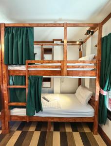two bunk beds in a room at PROpaganda Hostel in Thong Sala +26 photos