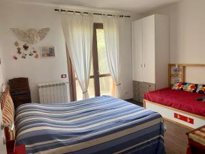 Postel nebo postele na pokoji v ubytování La casa di Anita