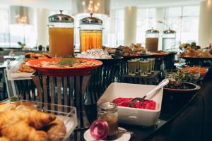 a buffet with many different types of food and drinks at Holiday Inn Abu Dhabi by IHG in Abu Dhabi