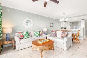 a living room with two couches and a table at Beach House 432 in Tybee Island