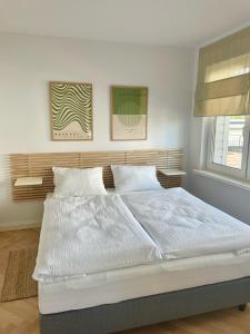 Posteľ alebo postele v izbe v ubytovaní Apartamenty Studio
