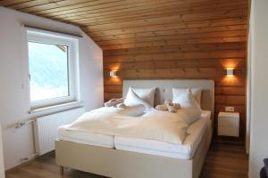 Posteľ alebo postele v izbe v ubytovaní Panorama Appartements Mora - 3 Edelweiß Superior