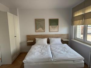 Posteľ alebo postele v izbe v ubytovaní Apartamenty Studio