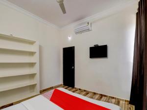 Ένα ή περισσότερα κρεβάτια σε δωμάτιο στο Hotel O SV