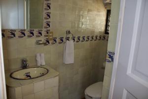 Koupelna v ubytování Hotel Mythos
