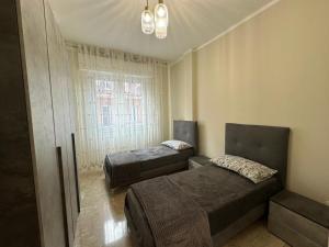 Ένα ή περισσότερα κρεβάτια σε δωμάτιο στο Blue Line Apartment