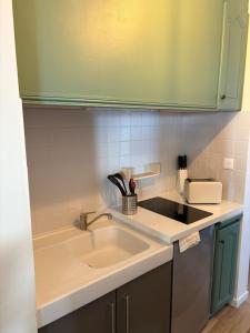 a kitchen with a sink and a counter top at Coeur de Moustiers pour 2 personnes in Moustiers-Sainte-Marie