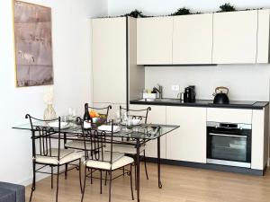 a kitchen with a table and chairs in a room at Suite with Private Courtyard - Colosseum & Forum in Rome