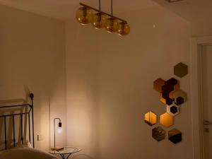 a bedroom with a wall with squares on it at Suite with Private Courtyard - Colosseum & Forum in Rome
