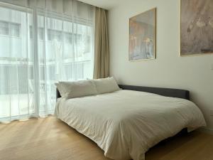 a bed in a room with a large window at Suite with Private Courtyard - Colosseum & Forum in Rome
